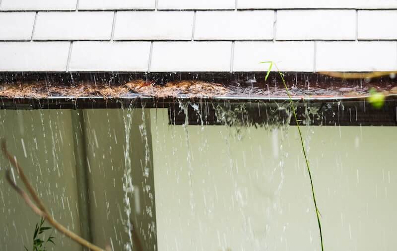Gutter overflowing from a heavy rain storm
