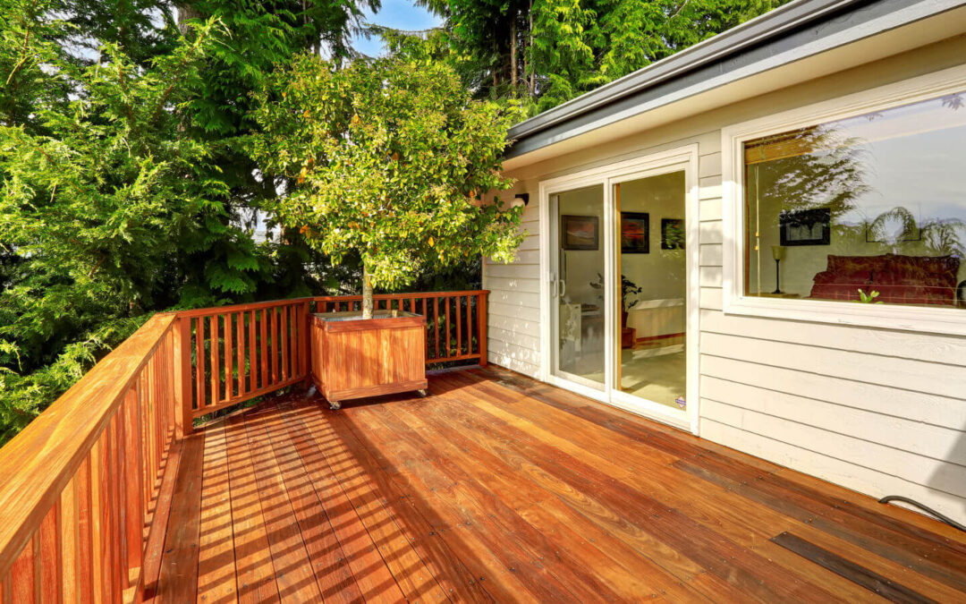 A beautifully designed deck nestled in a wooded setting, presenting thoughtful landscaping, and demonstrating how innovative design elements can enhance an outdoor living space